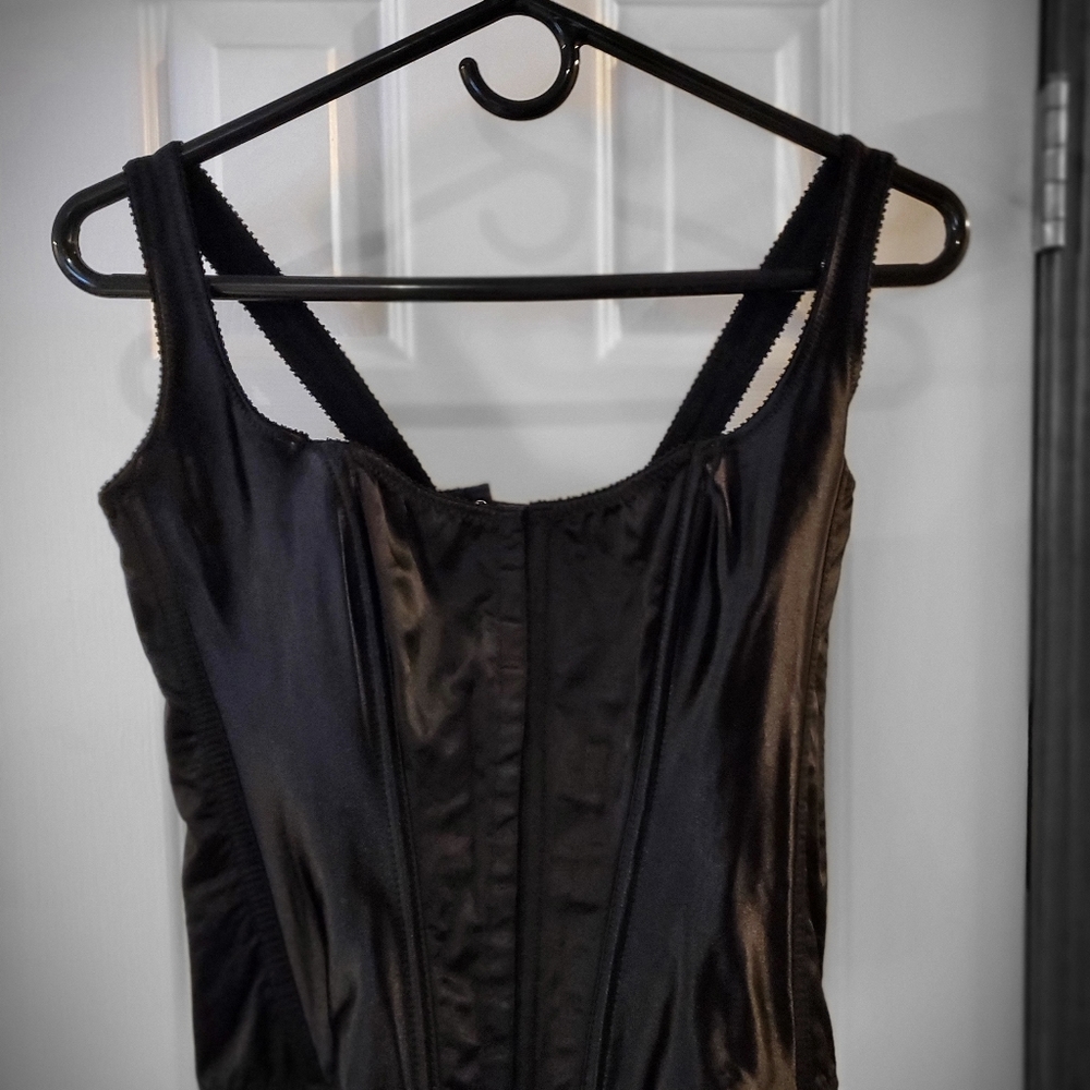 A black shoulder straped Corset.